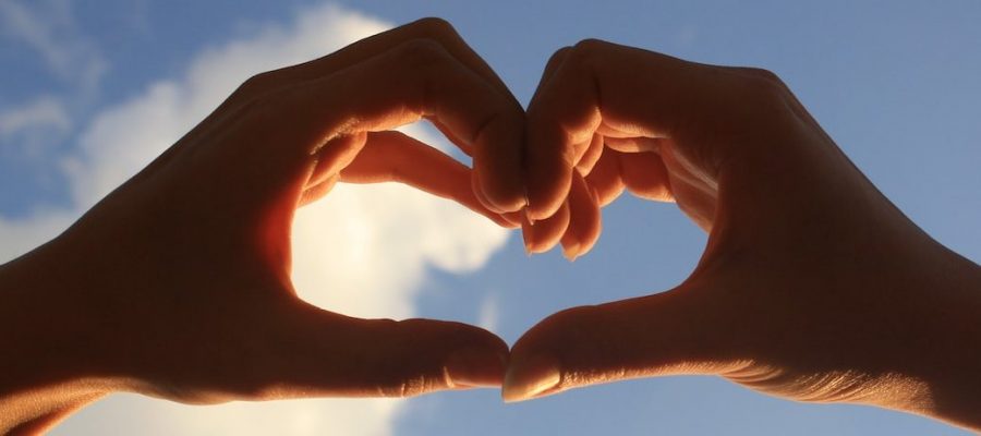 2 hands forming heart shape
